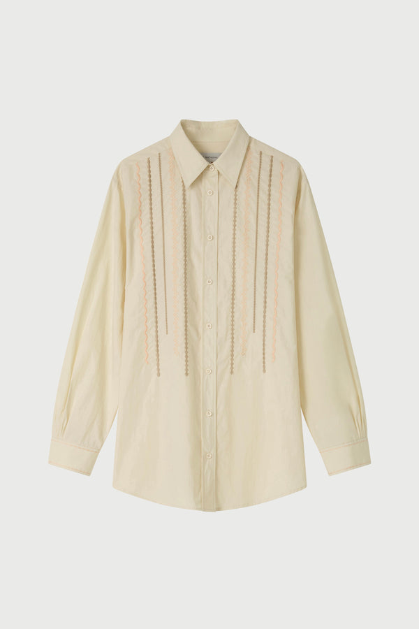 Beige button-up shirt on a light gray background