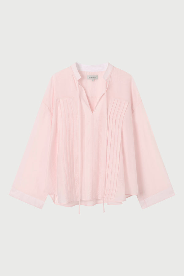  light pink shirt on a white background