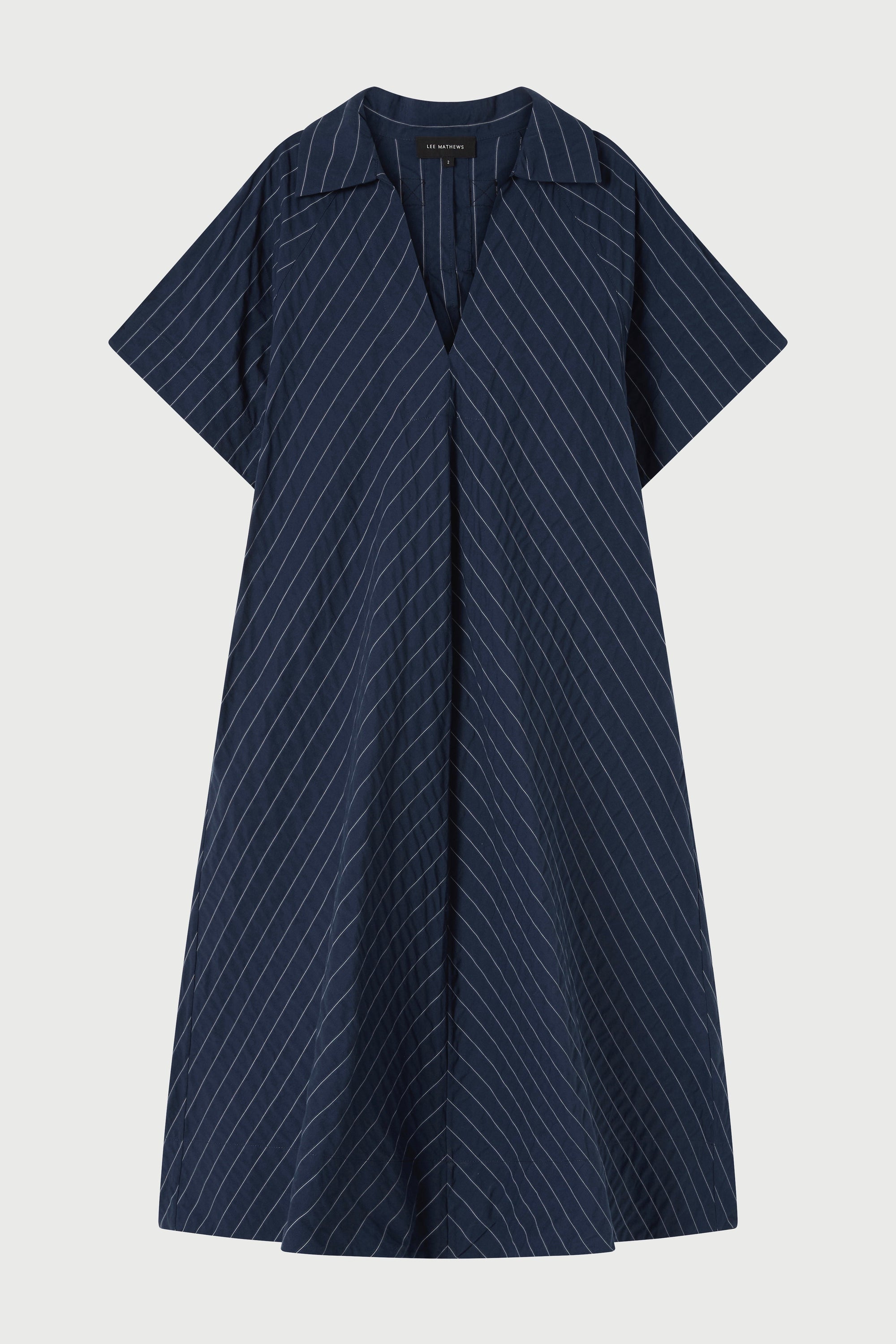 Navy pinstripe dress on a light gray background