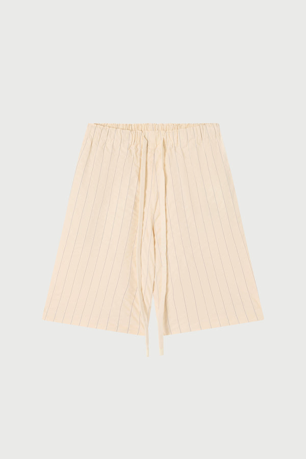 Cream seersucker shorts on a white background